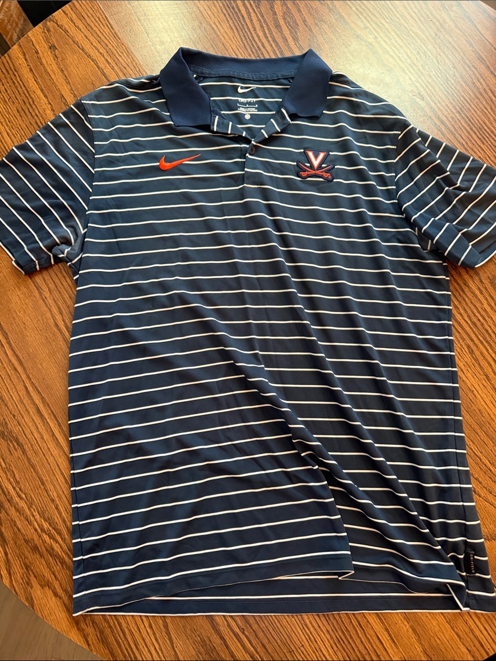 Nike Navy and White Striped Polo with Orange Swoosh and Team Crest